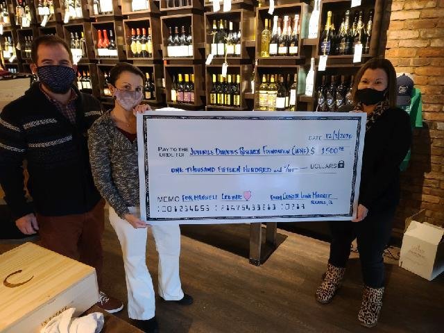 Coastal Wine Market & Tasting Room in Nocatee donates $1,500 to the Juvenile Diabetes Research Foundation.